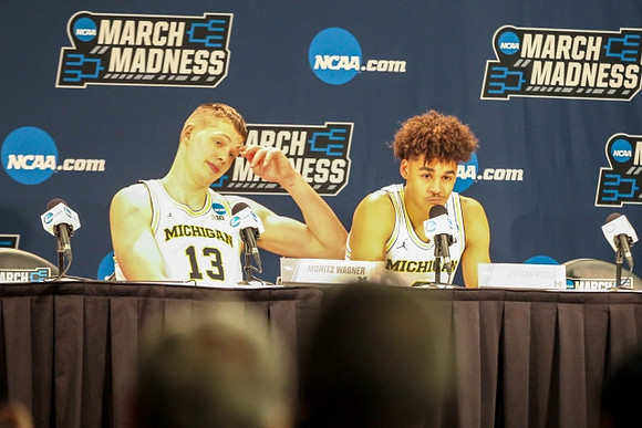Moritz Wagner (13) and Jordan Poole (2)