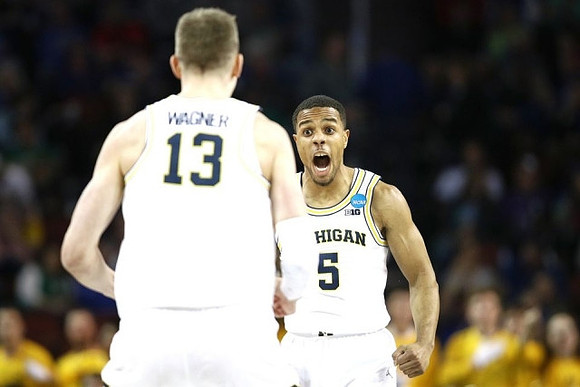 Moritz Wagner (13) and Jaaron Simmons (5)