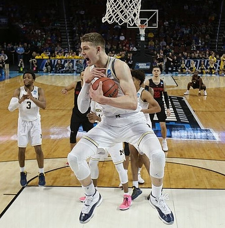 Zavier Simpson (3), Moritz Wagner (13), and Jordan Poole (2)
