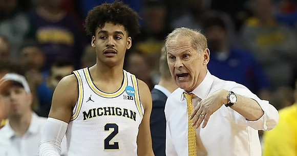 Jordan Poole (2) and John Beilein
