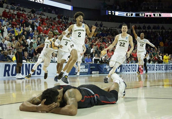 Jordan Poole (2), Charles Matthews (1), Zavier Simpson (3), Duncan Robinson (22), and Muhammad-Ali Abdur-Rahkman (12)