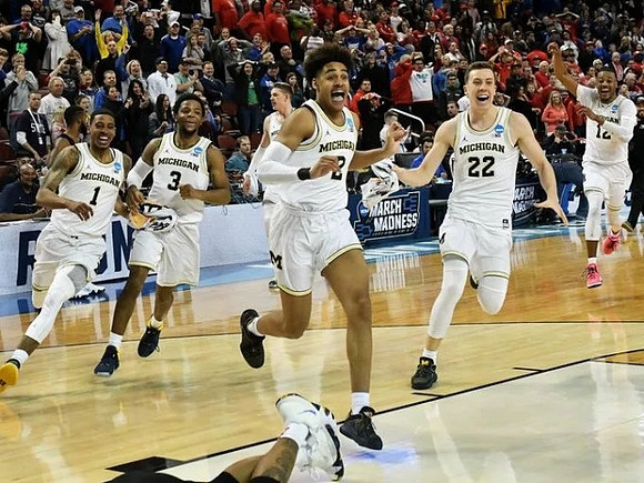 Jordan Poole (2), Charles Matthews (1), Zavier Simpson (3), Moritz Wagner (13), Duncan Robinson (22), and Muhammad-Ali Abdur-Rahkman (12)
