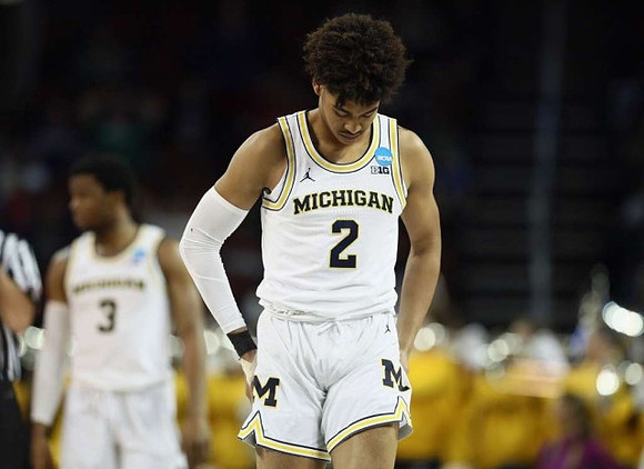 Jordan Poole (2) and Zavier Simpson (3)