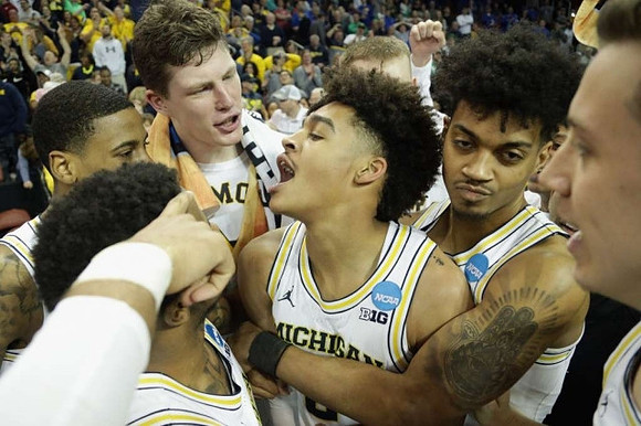 Zavier Simpson (3), Charles Matthews (1), Jon Teske (15), Jordan Poole (2), Ibi Watson (23), and Duncan Robinson (22)