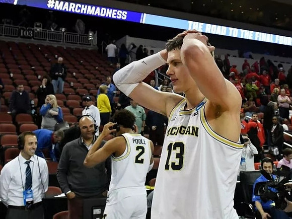 Jordan Poole (2) and Moritz Wagner (13)