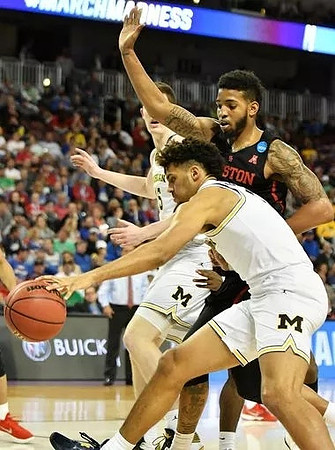 Jon Teske (15) and Isaiah Livers (4)