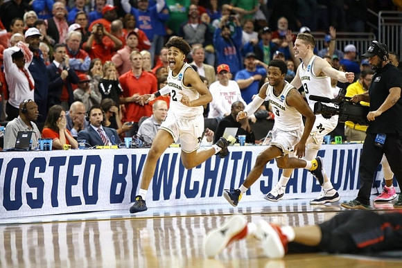 Jordan Poole (2), Zavier Simpson (3), and Moritz Wagner (13)