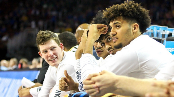 Jon Teske (15), Ibi Watson (23), and Isaiah Livers (4)
