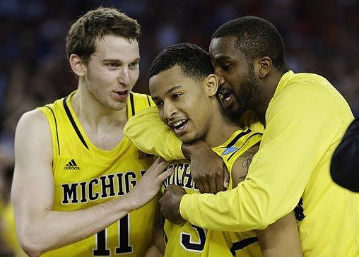 Nik Stauskas (11), Trey Burke (3), and Corey Person (32)