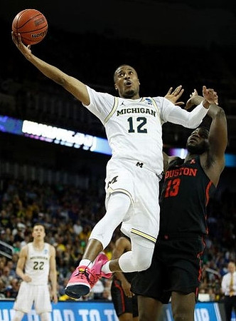 Muhammad-Ali Abdur-Rahkman (12) and Duncan Robinson (22)