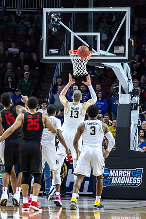 Muhammad-Ali Abdur-Rahkman (12), Moritz Wagner (13), and Zavier Simpson (3)