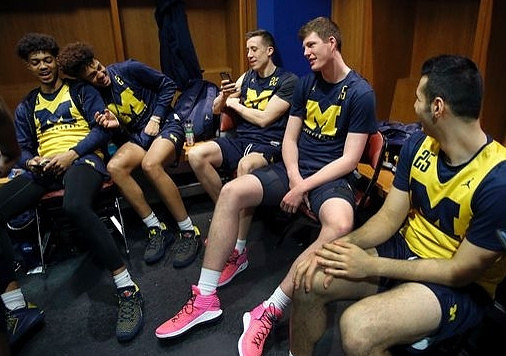 Ibi Watson (23), Jordan Poole (2), Duncan Robinson (22), Moritz Wagner (13), and Naji Ozeir (25)