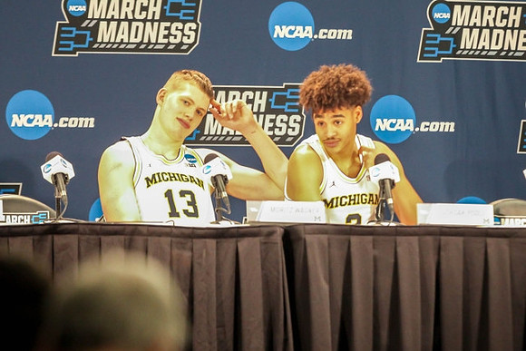 Moritz Wagner (13) and Jordan Poole (2)