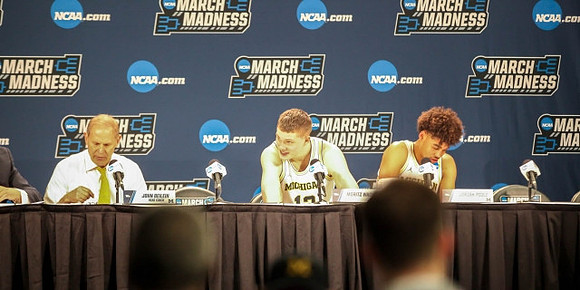 John Beilein, Moritz Wagner (13), and Jordan Poole (2)