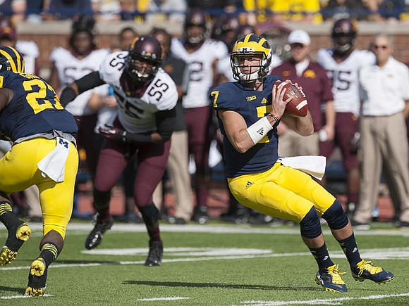 Shane Morris (7) and Derrick Green (27)