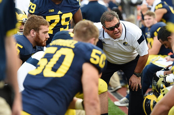 Tom Strobel (50) and Brady Hoke