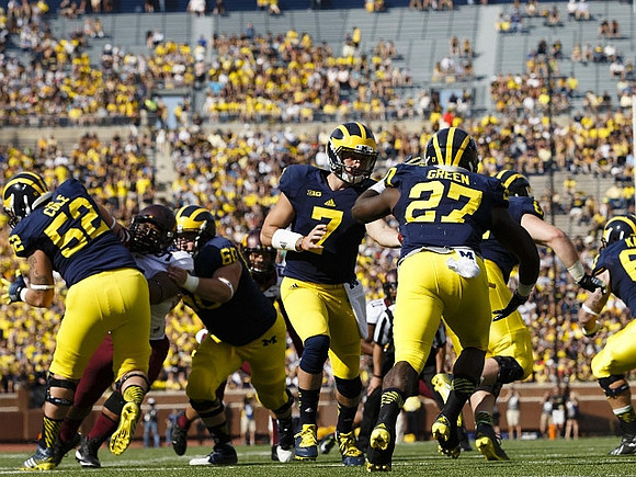 Mason Cole (52), Jack Miller (60), Shane Morris (7), and Derrick Green (27)
