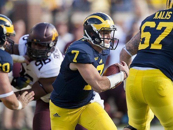 Shane Morris (7) and Kyle Kalis (67)