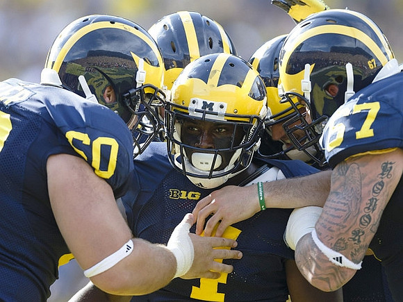Jack Miller (60), De'Veon Smith (4), and Kyle Kalis (67)