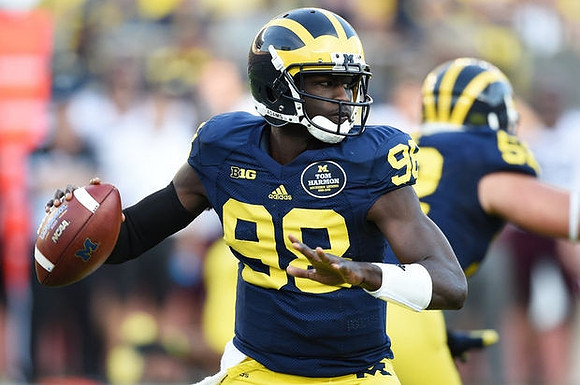 Devin Gardner (98) and Mason Cole (52)