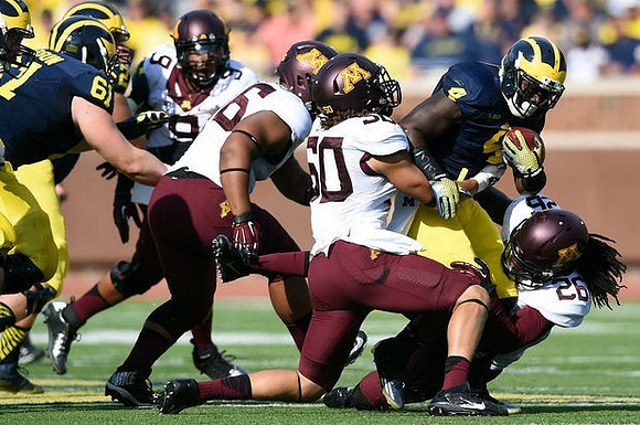 Graham Glasgow (61) and De'Veon Smith (4)