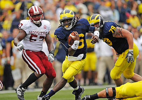 Denard Robinson (16) and Perry Dorrestein (79)