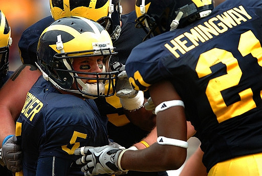 Tate Forcier (5) and Junior Hemingway (21)