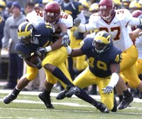 Steve Breaston (15) and John Thompson (49)