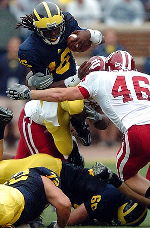Denard Robinson (16), Mark Huyge (72), and David Moosman (60)