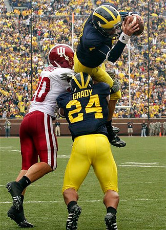 Kevin Grady (24) and Tate Forcier (5)
