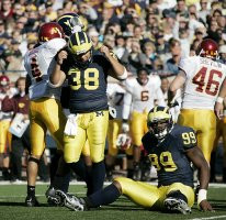 Garrett Rivas (38) and Pierre Woods (99)