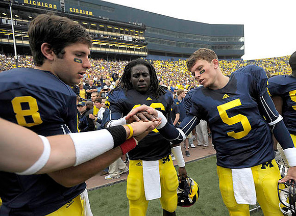 Nick Sheridan (8), Denard Robinson (16), and Tate Forcier (5)