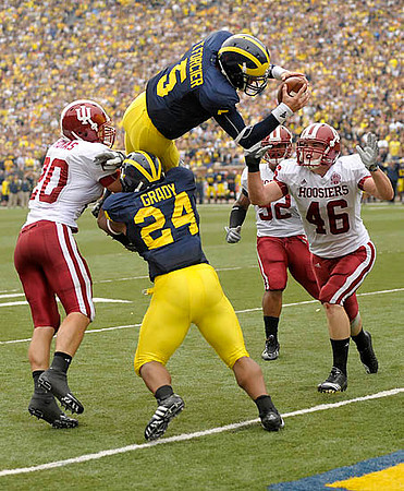 Kevin Grady (24) and Tate Forcier (5)
