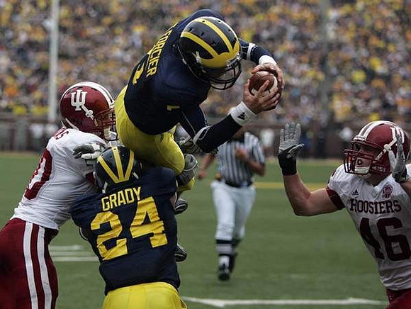 Kevin Grady (24) and Tate Forcier (5)