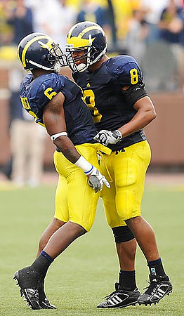 Donovan Warren (6) and Jonas Mouton (8)