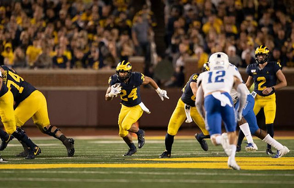 Ben Bredeson (74), Zach Charbonnet (24), Sean McKeon (84), and Shea Patterson (2)
