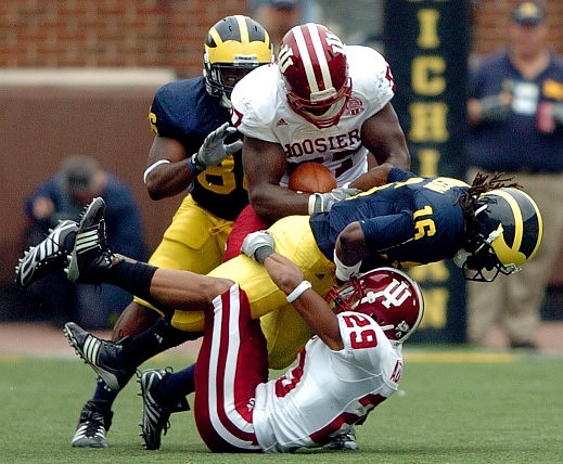 Denard Robinson (16) and Kevin Koger (86)