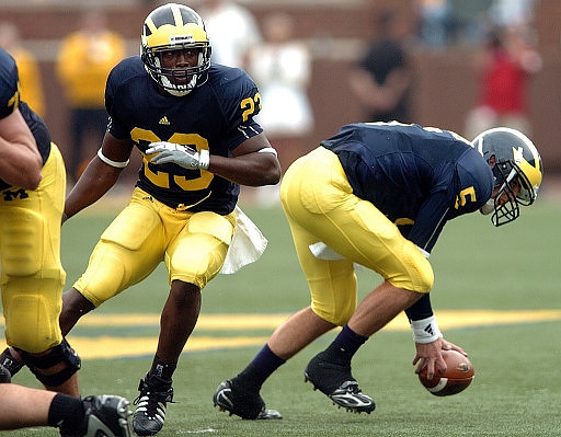 Carlos Brown (23) and Tate Forcier (5)