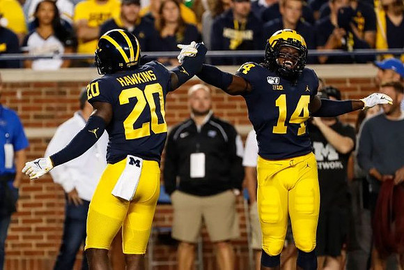 Brad Hawkins (20) and Josh Metellus (14)