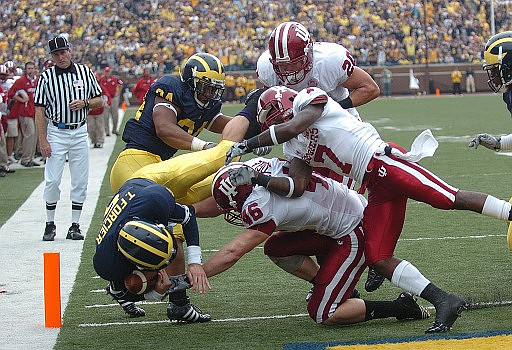 Kevin Grady (24) and Tate Forcier (5)