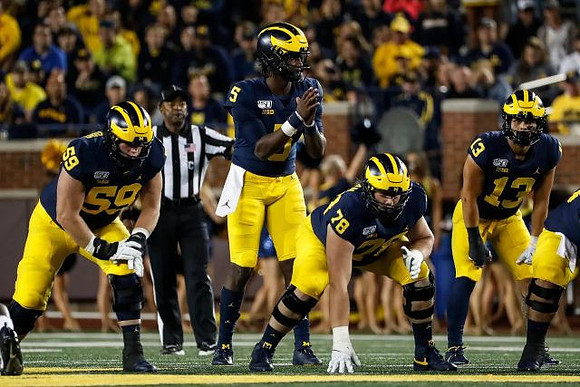 Joel Honigford (59), Joe Milton (5), Griffin Korican (78), and Tru Wilson (13)