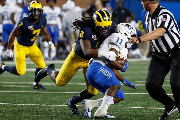 Khaleke Hudson (7) and Devin Gil (8)