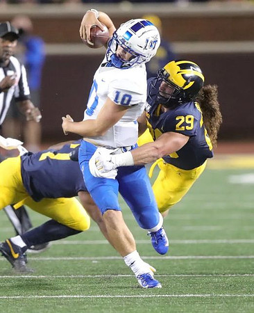 Khaleke Hudson (7) and Jordan Glasgow (29)