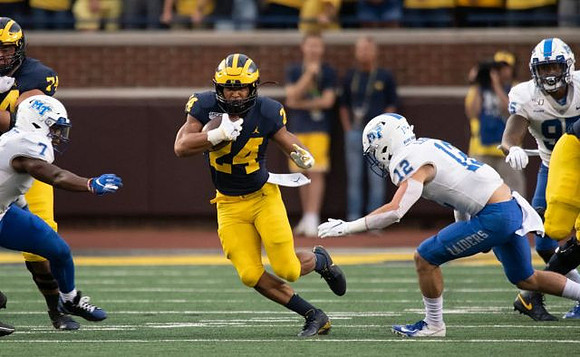 Ben Bredeson (74) and Zach Charbonnet (24)