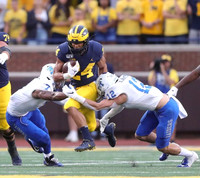 Ben Bredeson (74) and Zach Charbonnet (24)