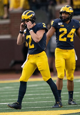 Shea Patterson (2) and Zach Charbonnet (24)