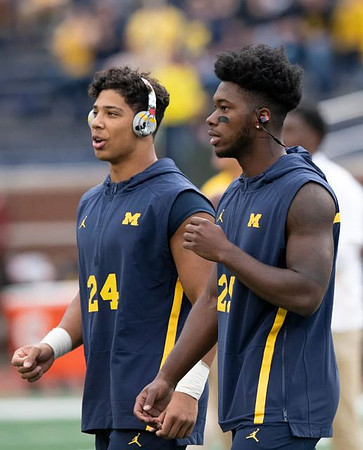 Zach Charbonnet (24) and Hassan Haskins (25)