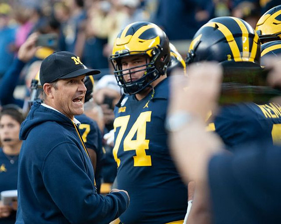 Jim Harbaugh, Ben Bredeson (74), and Carlo Kemp (2)