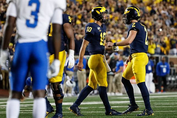 Cesar Ruiz (51), Dylan McCaffrey (10), and Shea Patterson (2)
