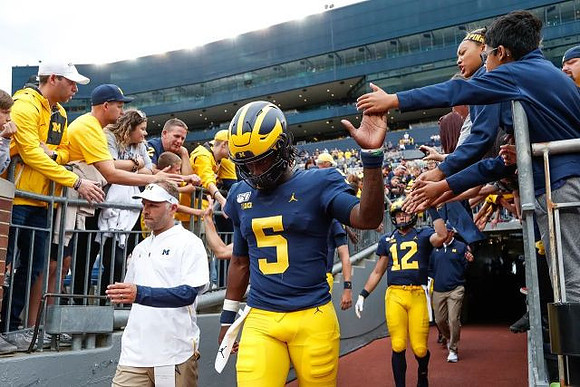Joe Milton (5) and Cade McNamara (12)